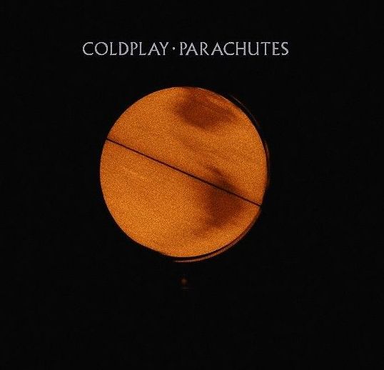 an orange circle with the words coldplay parachutes on it's side