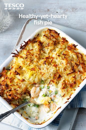 a casserole dish with meat and vegetables in it on a plate next to a fork