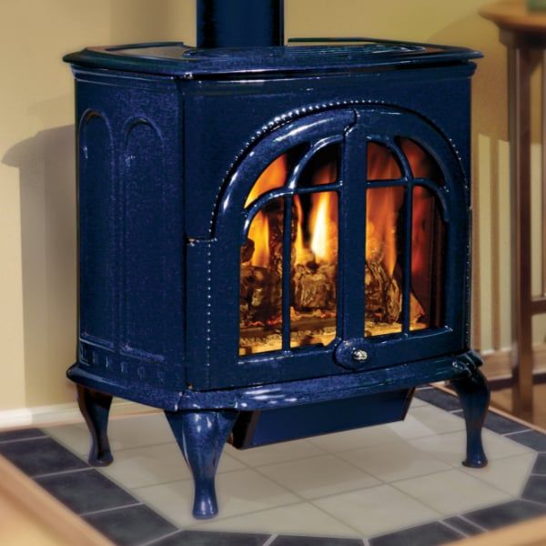 a blue stove with a fire burning in it