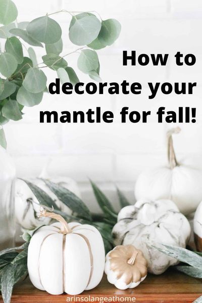 white pumpkins and greenery with the words how to decorate your mantle for fall