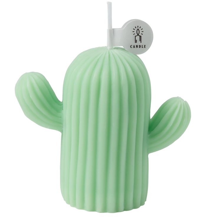 a green cactus shaped candle with a white tag on it's top and the word,