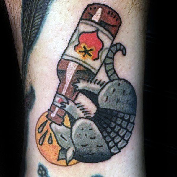 a tattoo on the arm of a man with an image of a bird and a bottle