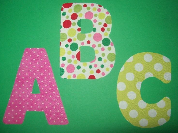 the letters are made up of polka dot fabric