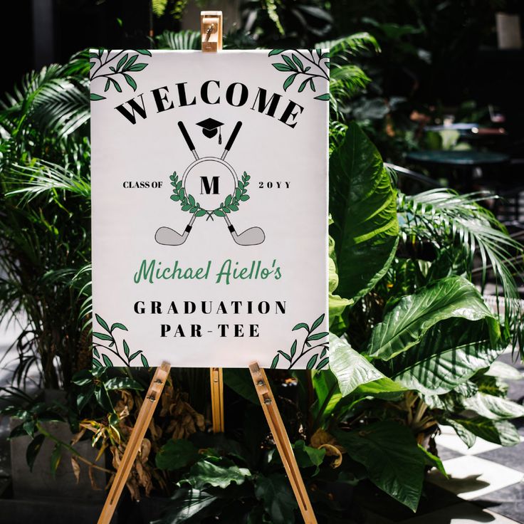 a welcome sign for michael allen's graduation party in front of some tropical plants