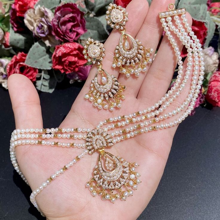 Featured is an all pearl jadau necklace set in 22k gold. The necklace can be worn both as a choker as well as a short necklace with tassle adjustment. The necklace weighs 30.40 gms including 17.71 gms in the stringing and hanging pearl beads The earrings weigh 11.65 gms including 1.17 gms in the hanging pearls. Price Breakup Summary Component Rupees % of Total 22k Gold 120,075 74.0% Stones & Beads 15,925 9.8% Making Charges 21,614 13.3% Taxes (GST) 4,728 2.9% Total 162,343 100.0% View Detailed B Jadau Necklace Set, Pearl Choker Set, 22k Gold Jewelry Necklaces, Jadau Necklace, Pearl Mala, 22k Gold Jewelry, Buy Pearls, Pearl Necklace Set, Choker Set