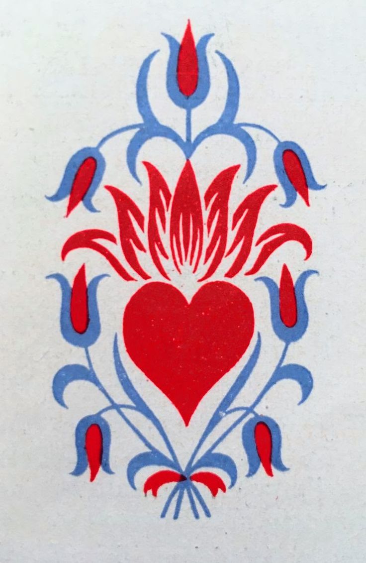 a red heart with blue and white designs on it