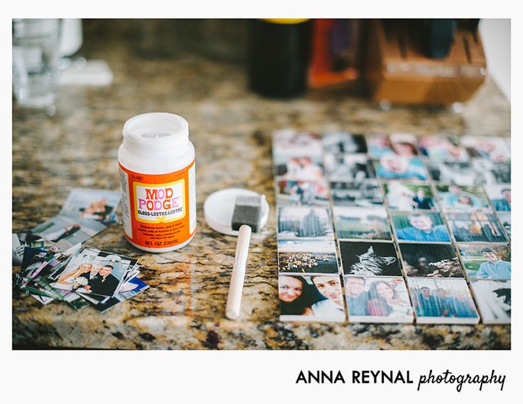 an assortment of photos and a toothbrush sitting on a counter top next to them