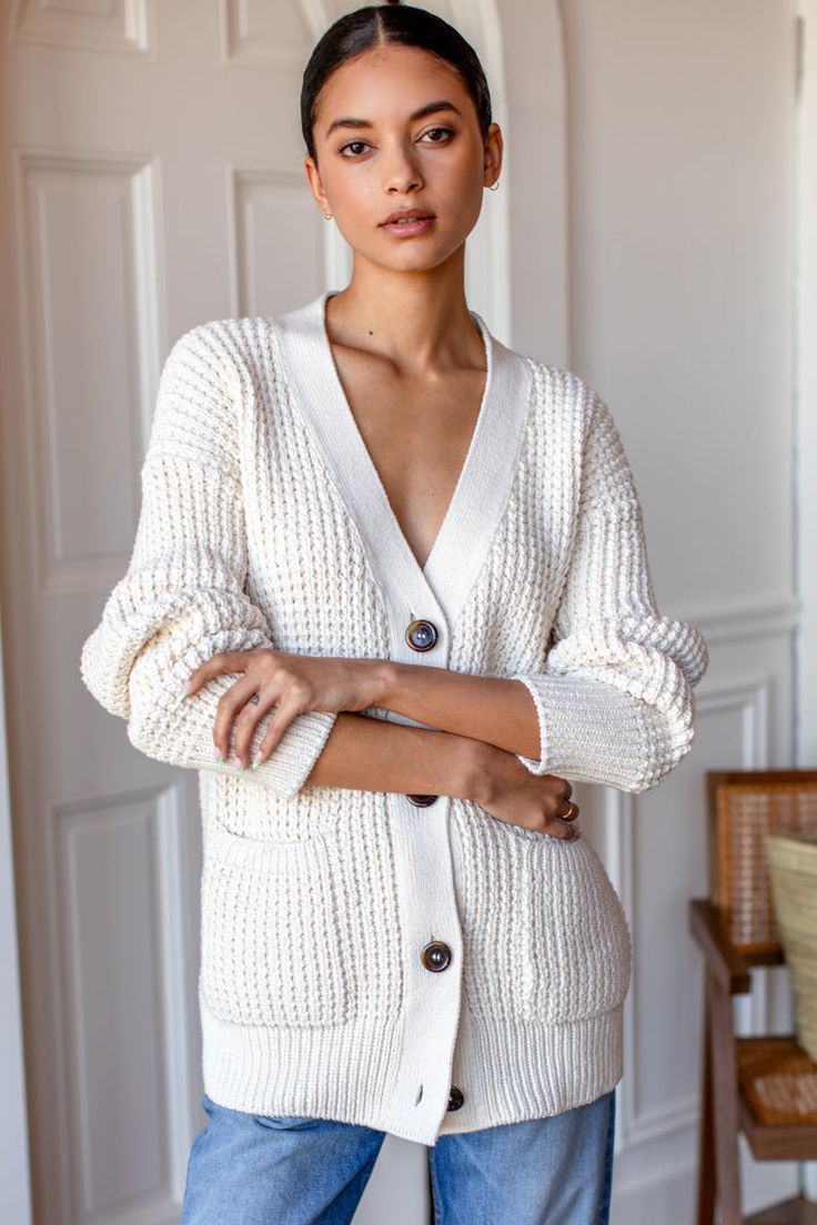 Cotton Chunky Knit Cardigan For Layering, Chunky Knit Cotton Cardigan For Layering, Winter White V-neck Outerwear For Layering, Chunky Knit Cotton Outerwear For Layering, Winter White Long Sleeve Loungewear Cardigan, White Long Sleeve Cardigan For Loungewear, Elegant Textured Knit Cotton Sweater, Elegant White Cardigan For Loungewear, Elegant White Loungewear Cardigan