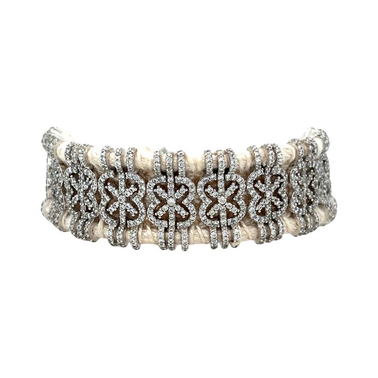 A modern twist on the Diamond bracelet. Vanilla braided cotton thread bracelet. It is adorned with a 925 Silver structure set with hundreds of Diamonds. Vanilla 8.5 ctw Diamonds Size 6.5" 925 Silver Braided cotton thread Van Den Abeele Luxury Adjustable Braided Jewelry, Elegant Braided Sterling Silver Bracelet, Elegant Braided Bracelet Jewelry, Elegant White Woven Jewelry, White Elegant Woven Jewelry, Elegant Woven Adjustable Bracelets, Elegant Adjustable Woven Bracelets, Elegant Braided Silver Jewelry, Elegant Silver Braided Jewelry