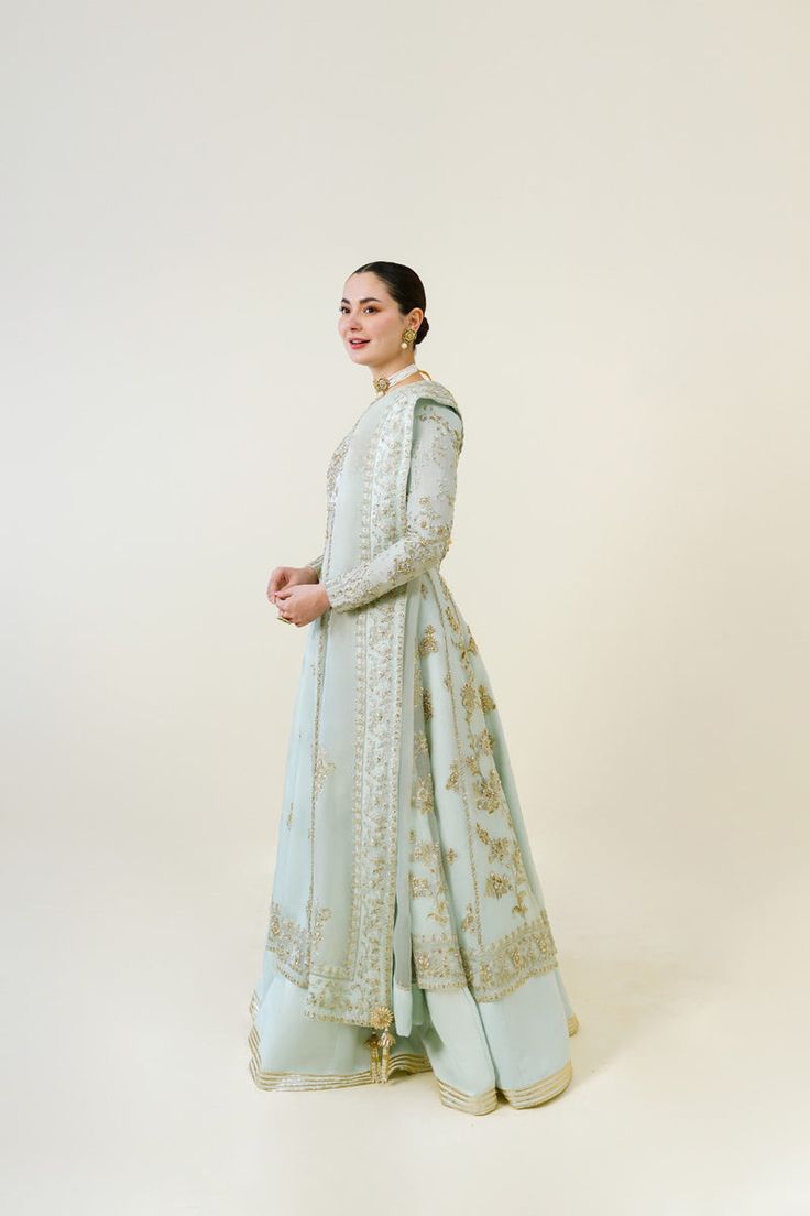 An embodiment of ethereal grace. A beautiful festive design in the captivating signature long panelled Agha Noor pishwas silhouette, crafted from pure soft organza heavily embellished with gold zardozi craftsmanship, each stitch is a testament to generations of artistry. Completing the Azeena masterpiece is a soft pure Agha Noor, Simple Kurti, Simple Kurti Designs, Paneled Skirt, Boutique Dress Designs, Boutique Dress, Organza Dupatta, Festive Design, Bridal Designs