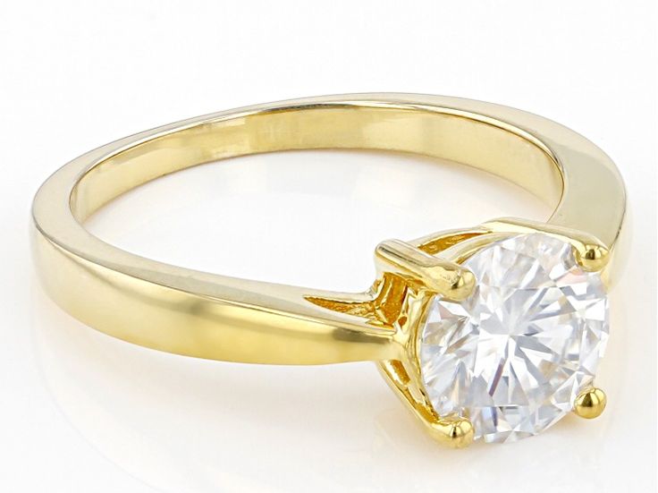 Moissanite Fire(R) 1.50ct round diamond equivalent weight, 14k yellow gold over sterling silver solitaire ring. Measures 3/16" L x 1/16" W and is not sizeable. Actual moissanite weight is 1.35ct. Yellow Gold Solitaire Jewelry, 14k Gold Jewelry With Round Cut Center Stone, Yellow Gold Jewelry With Round Cut Center Stone, Classic Solitaire Cubic Zirconia Jewelry, Yellow Gold Moissanite Jewelry With Center Stone, Classic Gold Solitaire Jewelry, Fine Gold Solitaire Jewelry, Vvs Clarity Round Cut Jewelry For Promise Ring, Gold Moissanite Ring With Round Stone