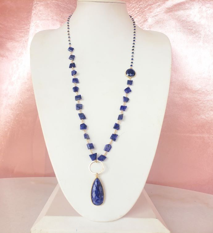 Kaylee Necklace in Sapphire - A versatile long style necklace made with labradorite. This necklace can be layered, worn as a lariat, or adjusted to have either the chunky chain or simple chain as the detail of your center piece. | A Blonde and Her BagKaylee Necklace in Sapphire. A versatile long style necklace made with labradorite. This necklace can be layered, worn as a lariat, or adjusted to have either the chunky chain or simple chain as the detail of your center piece. Size: 38" Length, 2" Elegant Labradorite Necklace With Adjustable Chain, Long Lariat Necklace With Natural Stones, Gemstone Lariat Long Necklace As A Gift, Elegant Labradorite Beaded Necklaces, Sausalito California, Simple Chain, Beaded Pendant Necklace, Sapphire Pendant, Long Style