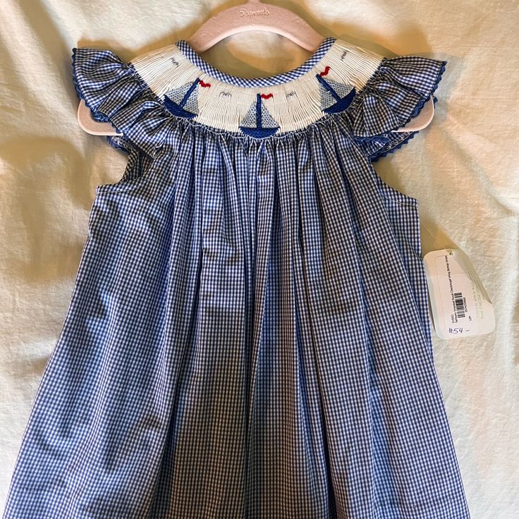 Nwt Smocked Dress. Size 12 Months Sleeveless Smocked Dress With Smocked Cuffs, Cute Sleeveless Dress With Smocked Cuffs, Casual Smocked Dress With Smocked Back For Playtime, Cute Navy Sleeveless Dress, Cute Sleeveless Navy Dress, Sleeveless Smocked Dress For Playtime, Fitted Blue Smocked Dress For Playtime, Sleeveless Smocked Dress With Smocked Back For Playtime, Cotton Smocked Dress With Ruffles For Playtime