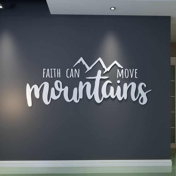 there is a sign that says faith can move mountains on the side of a wall