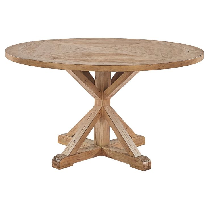 a round wooden table with four legs and a cross - legged design on the top