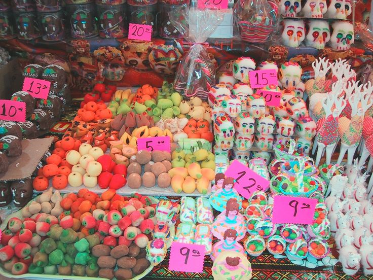 there are many different items on display in the store for sale, including skulls and candies