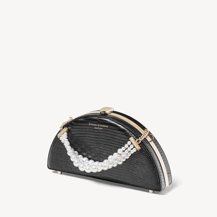 Luna Clutch in Black Lizard | Aspinal of London Elegant Pearl Evening Bag For Events, Elegant Pearl Clutch For Events, Luxury Pearl Clutch For Party, Elegant Top Handle Shoulder Bag As Fashion Accessory, Luxury Pouch Evening Bag With Pearl Handle, Chic Pearl Clutch For Formal Occasions, Luxury Evening Bag With Pearl Handle, Luxury Pearl Embellished Clutch Bag, Elegant Pearl Clutch With Pearl Handle