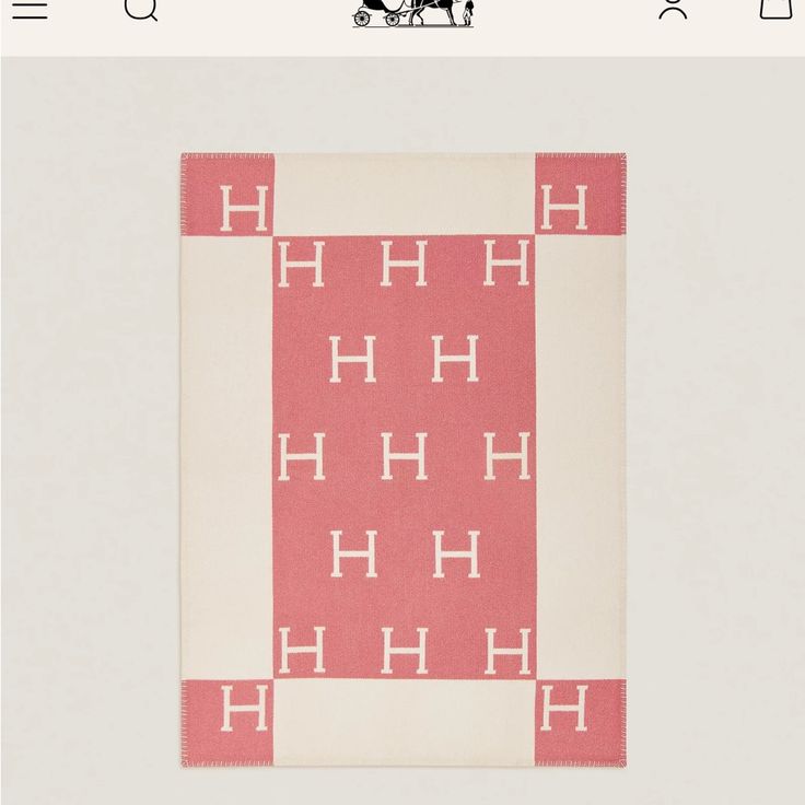 a pink and white rug with the letter h on it's side, in front of an image of a horse drawn carriage