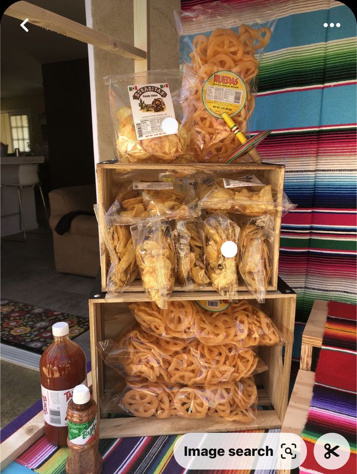 there are many different types of pretzels on the shelf and one is orange