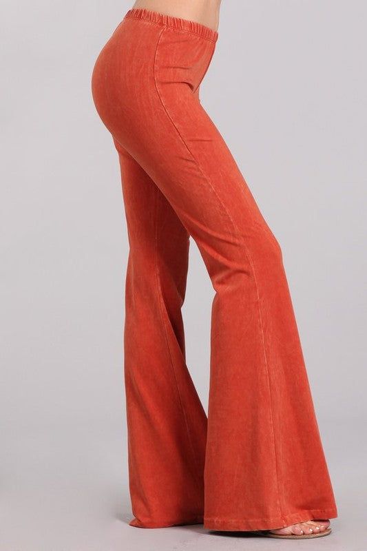 Experience luxury with our Chatoyant Mineral Wash Bell Bottoms! These pants have the appearance of mineral jeans, but the comfort of leggings and an elastic waist. Each one is uniquely hand-dyed, resulting in beautiful variations that add character. With an inseam of 33 inches and made in America with a blend of 93% cotton and 7% spandex, these pants are the epitome of premium quality. Perfect for resort wear, exude elegance and sophistication while staying comfortable and sexy. Check out all th Trendy Soft-washed Cotton Pants, Acid Wash Cotton Bottoms For Fall, Spring Soft-washed Cotton Pants, Soft-washed Cotton Pants For Spring, Trendy Soft-washed Jeans For Fall, Fall Soft-washed Wide Leg Bottoms, Fall Acid Wash Relaxed Fit Pants, Soft-washed Wide Leg Bottoms For Fall, Acid Wash Relaxed Fit Pants For Fall