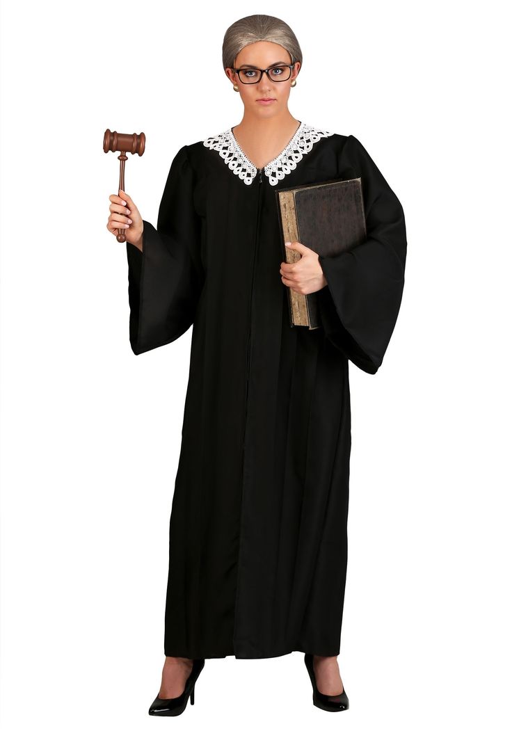 a woman in a judge outfit holding a gavel and a book