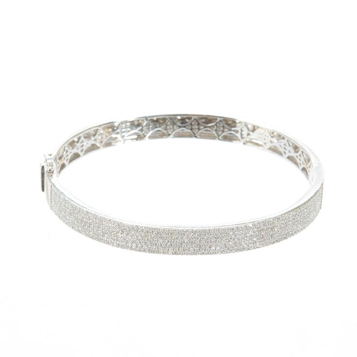 The name speaks for itself. This piece features a solid 14k white gold bangle covered in pave diamond with a secure side closure. Pave diamonds line half of this bracelet. Available in 14k white gold with white diamonds 14k 17.60g Total Diamond Weight 1.25ctwPlease note that some products are made to order. In some cases please allow 3-6 weeks for shipping. Thank you! White Gold Bangle, Starburst Necklace, Diamond Chain, Square Diamond, Gold Bangle, Diamond Bangle, Diamond Drops, Diamond Drop Earrings, Pearl Diamond