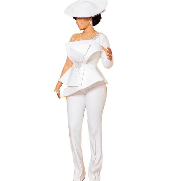 a woman in white is wearing a suit and hat