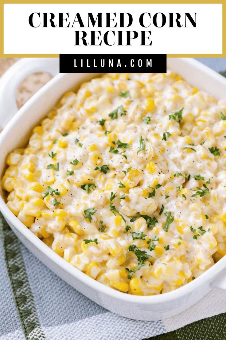 a white casserole dish filled with corn and topped with parmesan cheese