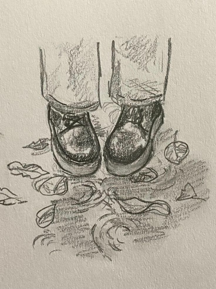 a drawing of two pairs of shoes on the ground