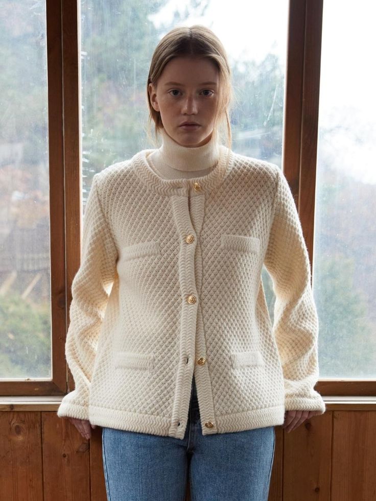 This is DEPOUND’s tweed jacket-style cardigan made from wool material. It's crafted using a high content of wool yarn, providing excellent insulation for wearing in cold winters. Made with a double-sided weave, it maintains its shape without stretching even after prolonged wear. The details are designed to have a structured fit similar to a jacket. It features a tweed-like weave pattern. The neckline, front opening, and sleeve cuffs are finished with contrasting fabric for added detail. It's a versatile item that can be worn as innerwear under a coat or heavy outerwear.- It's a great item for daily wear- You can style it with various looks- The classic touch is added with gold buttons engraved with the brand logo Wool Knitted Outerwear For Work, Knitted Wool Outerwear For Work, Knitted Merino Wool Outerwear For Work, Classic Wool Cardigan With Textured Knit, Classic Textured Knit Merino Wool Outerwear, Winter Workwear Cardigan With Textured Knit, Fall Wool Sweater Coat With Textured Knit, Classic Knitted Outerwear For Work, Wool Cable Knit Outerwear For Work