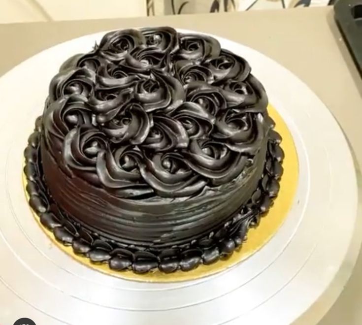 a chocolate cake sitting on top of a white plate