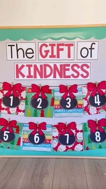 the gift of kindness is displayed in front of a sign with numbers and bows on it