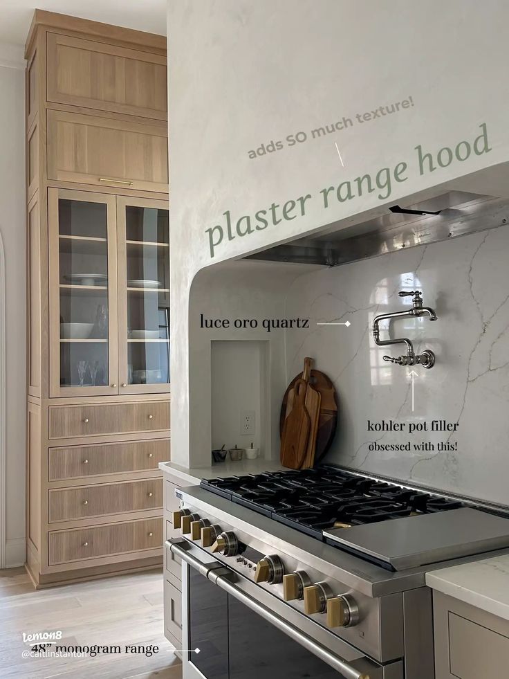 a stove top oven sitting inside of a kitchen next to a wall mounted oven and cabinets