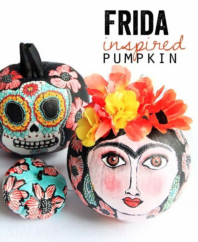 three painted pumpkins with flowers on them and the words frida inspired pumpkin written below