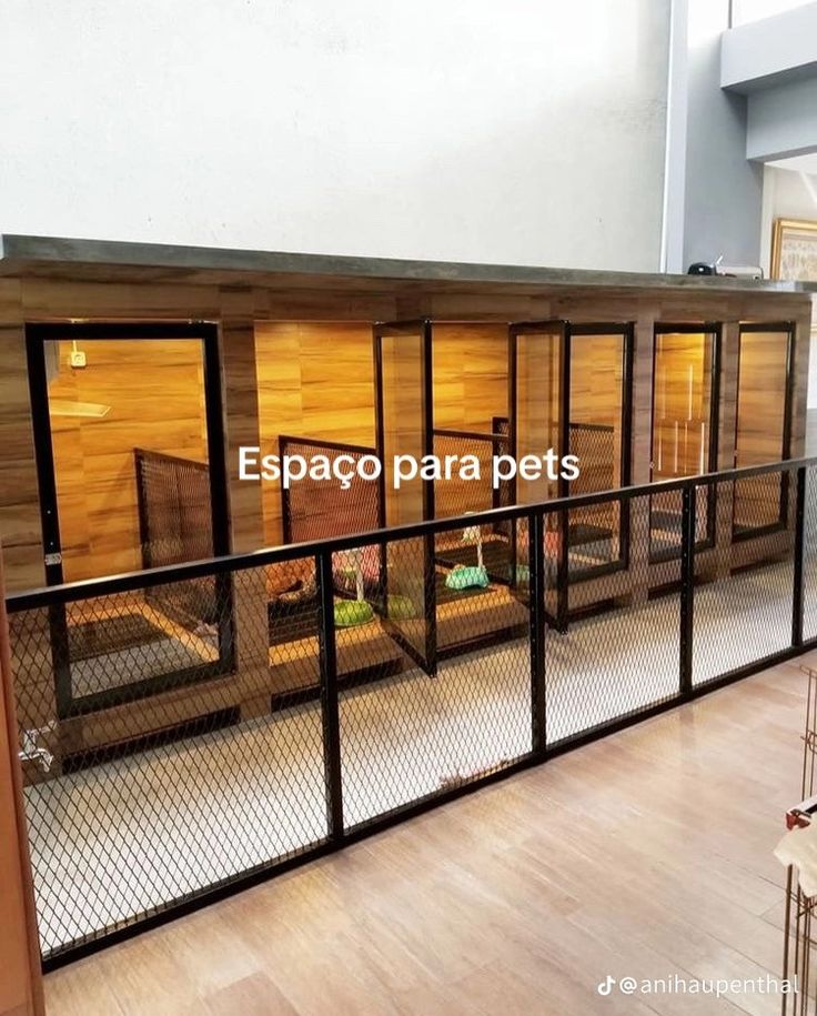 the inside of a building with wooden walls and glass doors on each side of it