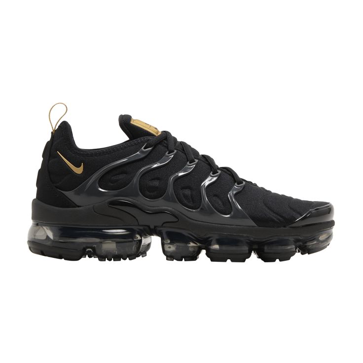 Find NIKE Air Vapormax Plus ' Metallic Gold on Editorialist. An all-black release that channels two Nike legacies in one, the Nike VaporMax Plus sneaker combines the wavy cage upper of the Nike Air Max Plus sneaker with the instantly recognizable cushioning unit of the Nike VaporMax shoe. This 'Black Metallic Gold' version features a blacked-out palette with a touch of metallic gold at the Swoosh, tongue and pull tab. Underfoot, a transparent VaporMax sole unit complements this ultra-sleek design. Functional Black Nike Air Max With Round Toe, Functional Nike Air Max With Air Cushioning, Black Dynamic Sneakers With Air Max Cushioning, Nike Air Max Cushioned Lace-up For Streetwear, Casual Nike Air Max For Streetwear With Air Cushioning, Nike Air Max Lace-up With Cushioned Footbed For Streetwear, Streetwear Sneakers With Air Cushioning, Nike Air Max High-top With Air Cushioning, Black Nike Air Max High-top With Air Cushioning