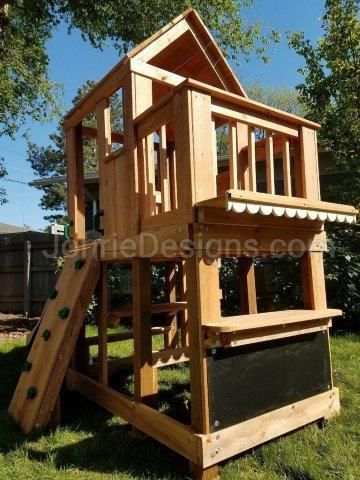 a wooden play set in the grass