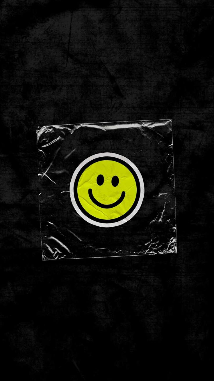 a yellow smiley face on a black background