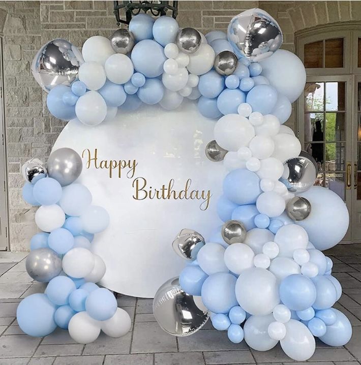 a birthday balloon arch with blue and white balloons