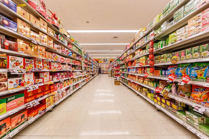 an aisle in a grocery store filled with lots of food