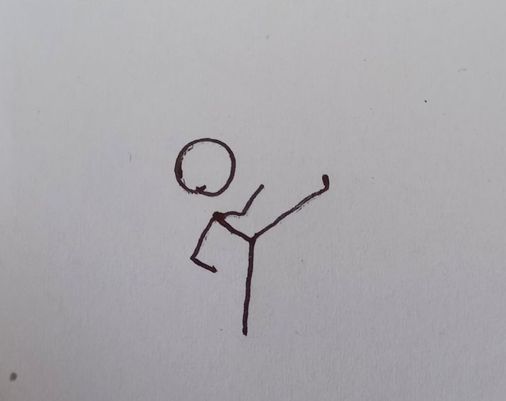 a drawing of a stick figure is shown in the middle of a piece of paper