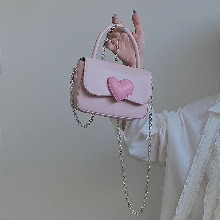 This girly heart bag is a great gift for that sweetheart in your life. Size: Width: 19cm Height: 11cm Pink Handheld Phone Bag Gift, Pink Handheld Phone Bag For Gift, Pink Heart-shaped Bag For Valentine's Day, Pink Shoulder Bag For Valentine's Day Gift, Cute Shoulder Bag For Valentine's Day, Cute Valentine's Day Crossbody Shoulder Bag, Trendy Heart-shaped Shoulder Bag For Valentine's Day, Heart-shaped Shoulder Bag With Heart Print, Valentine's Day Gift Shoulder Bag