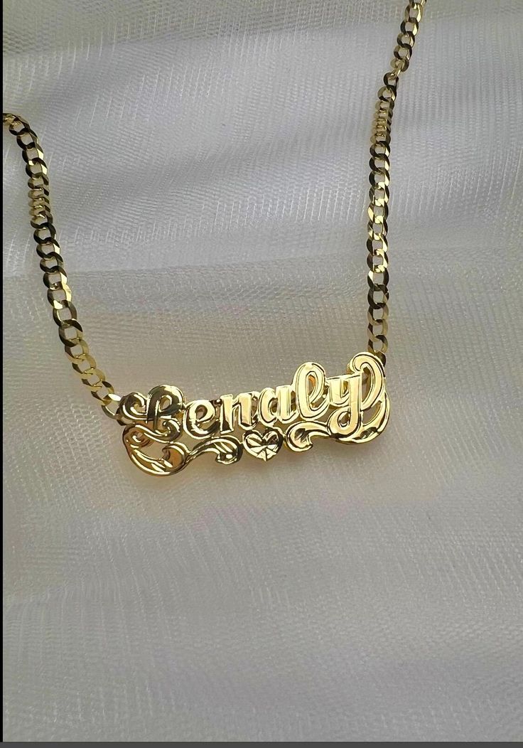 *Beautiful necklace Made in either 10k or 14k real solid gold, our double nameplates are personalized and made to order. Cuban link chain is 100% solid 10k or 14k gold heavyweight necklace. *Cuban link necklace weight approximately: 6-10 grams *Double name charm size approximately: 1.5"x1/5"inches (7 LETTERS MAX) -how to order: Select: DOUBLE NAME CHARM ONLY OR WITH 3MM NECKLACE SIZE. *3mm necklace size available: 14in,16in,18in,20in,22in,24inches. *Shipping:2-4 days  *Labor:1-5 days -Note: up t Pendant Name Necklace For Anniversary Gift, Custom Name Gold Plated Pendant Jewelry, Custom Name Gold Necklace With Heart Pendant, Gold Custom Name Heart Pendant Necklace, Custom Name 14k Gold Jewelry, Customized Gold Plated Jewelry For Personalized Gift, Custom Gold Necklace With Name On Heart Pendant, Customizable Gold Pendant Name Necklace, Customizable Yellow Gold Heart Pendant Name Necklace