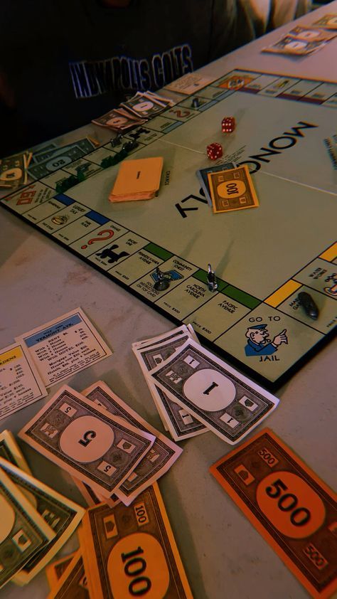 a monopoly board game with lots of money on the table