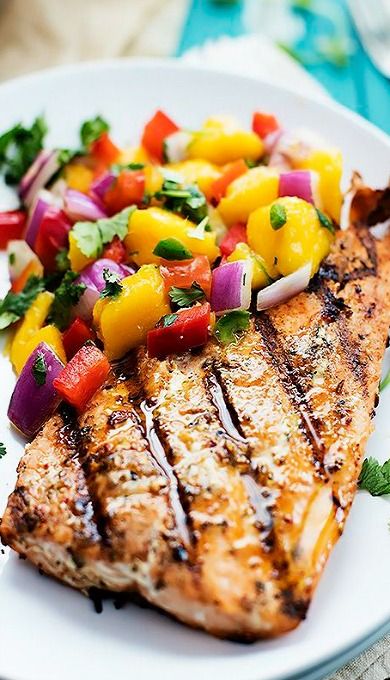 grilled salmon with mango salsa on a white plate