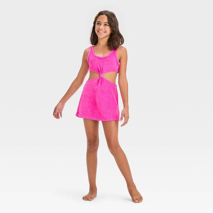 They can layer their after-swim looks while hanging out at the beach or poolside with this Solid Cut-Out Terry Cover-Up Dress from art class™ This sleeveless cover-up dress in a bright pink color features a center knot detail along with cutout sides and back for a stylish, breezy look. The cotton-blend terry fabric offers a cool and comfortable fit, while the pullover style allows for easy wear. Plus, the UPF 50+ rated finish offers added protection from UV rays. Welcome to art class™, where sty Summer Beach Season Tankini For Play, Summer Beach Tankini For Playwear, Summer Beach Tankini, Summer Tankini For Beachwear, Spring Beachwear Swimwear For Play, Summer Sleeveless Tankini For Play, Summer Beachwear Tankini For Playwear, Sleeveless Tankini For Summer Playwear, Playful Spring Beach Tankini