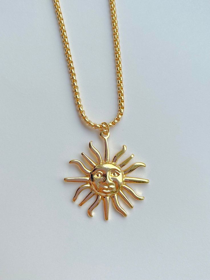 A beautiful and affordable gold coloured sun pendant. The chain is thick and durable, makes a great statement piece. This celestial sun necklace makes the perfect addition to any summer 2024 jewlery collection. Sun-shaped Necklace For Summer Gifts, Gold Clavicle Chain Necklace For Summer, Sun-shaped Necklace As A Summer Gift, Summer Gold Jewelry With Sun And Moon Design, Summer Sun Necklace For Gift, Gold Chain Necklace Summer Gift, Gold Chain Necklace As Summer Gift, Gold Metal Necklace For Summer, Trendy Gold Jewelry With Sun Design