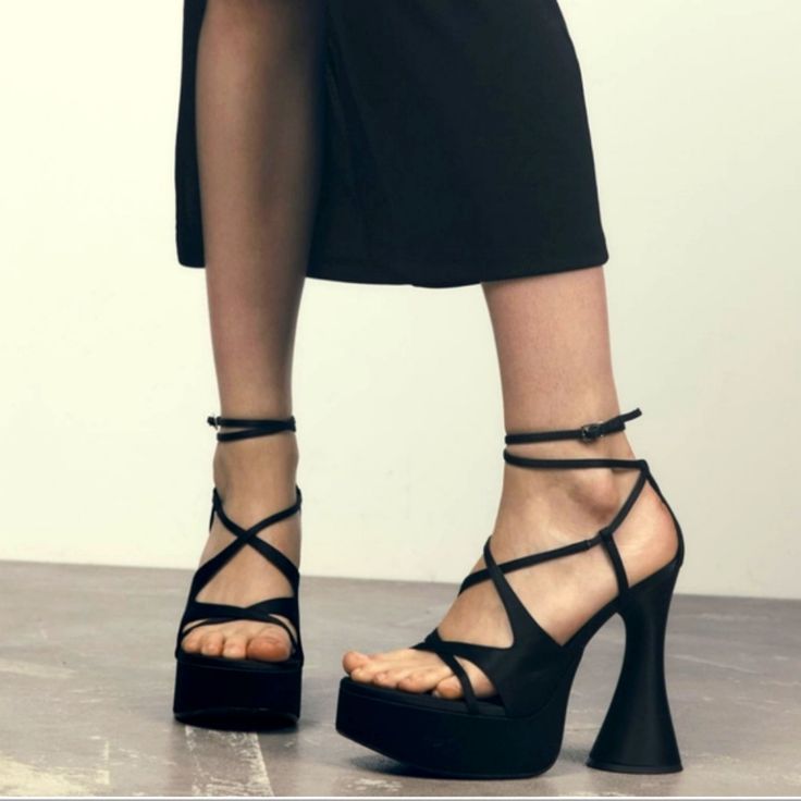 Strappy Platform Sandals Heeled Sandals In Satin Effect Fabric . Crossed Front Straps . High Geometric Platform Heel . Buckled Ankle Strap Closure .Heel Height: 5.3 Inches (13.5 Cm) Color: Black Upper 100% Polyester Lining 94% Polyurethane 6% Polyester Sole 100% Polyurethane Thermoplastic Insole 100% Polyester Which Has At Least: Upper 25% Certified Recycled Polyester Sole 30% Certified Recycled Synthetic Rubber Certified Materials New With Summer Strap Closed Toe Heels, Trendy Evening Platform Sandals, Summer Closed Toe Strap Heels, Summer Closed Toe Heels With Strap, Synthetic Strap Sandals For Night Out, Chic Ankle Strap Synthetic Sandals, Black Ankle Strap Sandals For Summer, Chic Ankle Strap Sandals In Synthetic Material, Trendy Evening Wedge Sandals With Ankle Strap