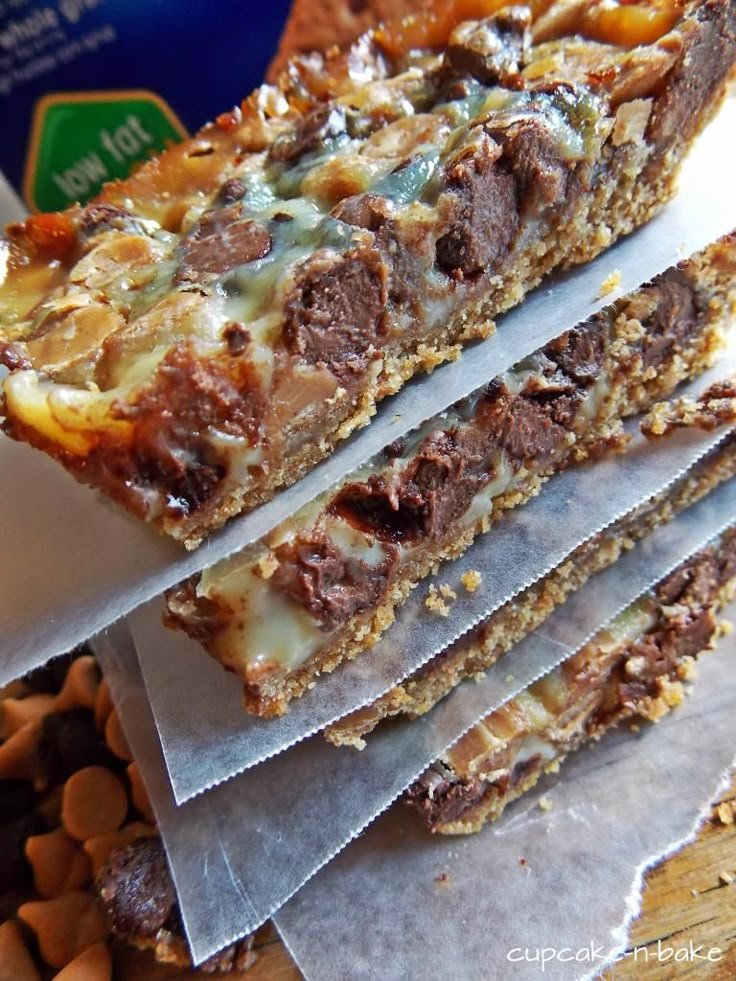 three pieces of chocolate and nuts bar sitting on top of each other