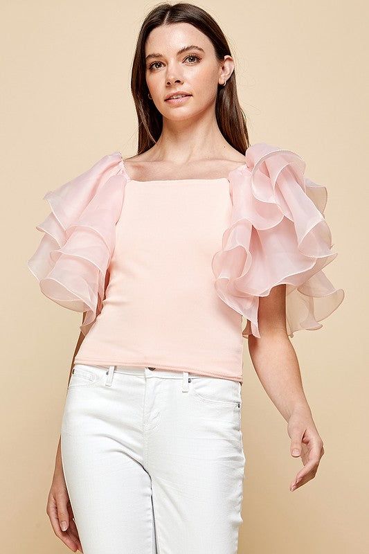 Refresh your wardrobe with this exquisite women's casual blouse. Cut from luxuriously soft fabric and finished with layered ruffles and short sleeves for a chic effect. A perfect statement piece for any special occasion or a casual day out. Peach color Layered Ruffles Short Sleeves Trendy Flutter Sleeve Top For Summer, Trendy Short Sleeve Top With Flutter Sleeve For Summer, Trendy Summer Short Sleeve Top With Flutter Sleeves, Chic Short Sleeve Tops For Brunch, Trendy Ruffled Evening Blouse, Trendy Ruffled Blouse For Evening, Elegant Tops With Ruffle Hem For Day Out, Feminine Party Blouse With Ruffle Hem, Chic Tops With Ruffle Hem For Party